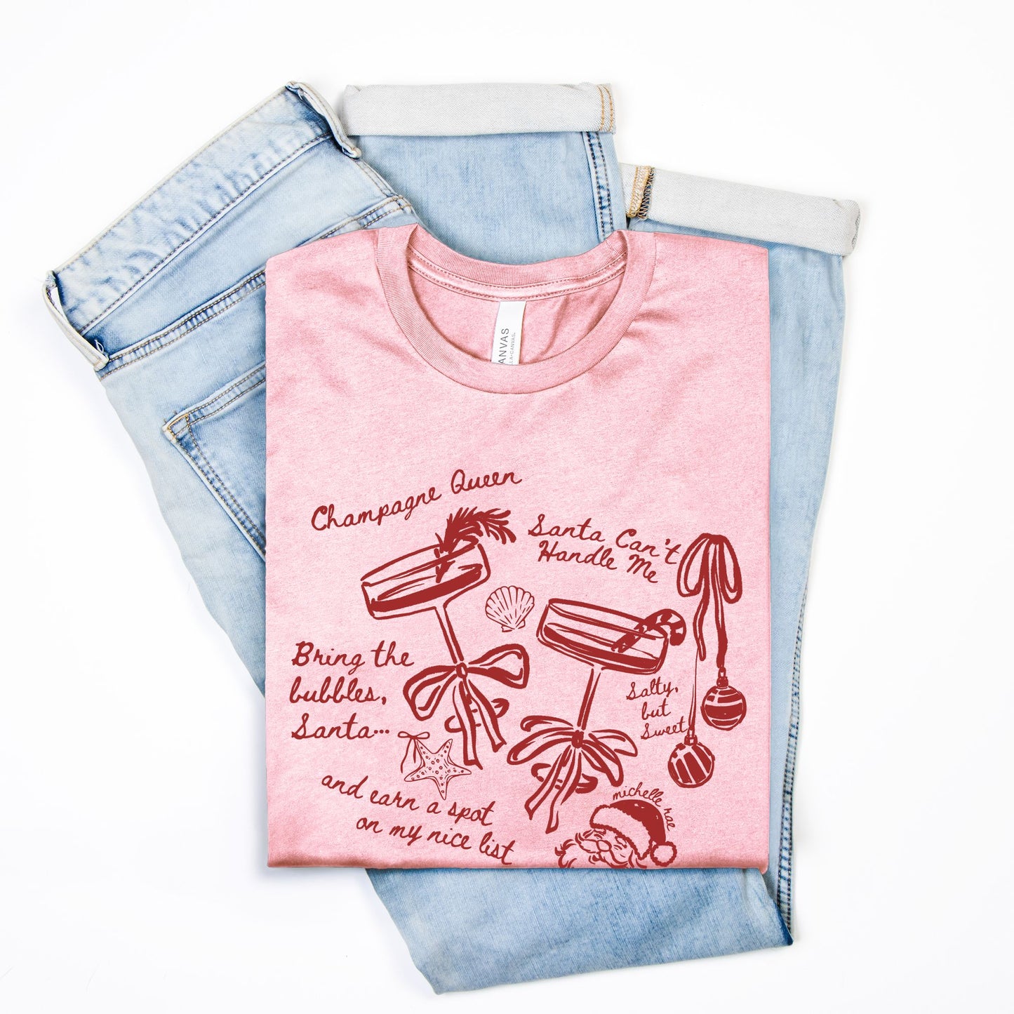Champagne Queen Christmas Seashell Pink Tee – Coastal Santa Graphic Tee for Winter Comfort