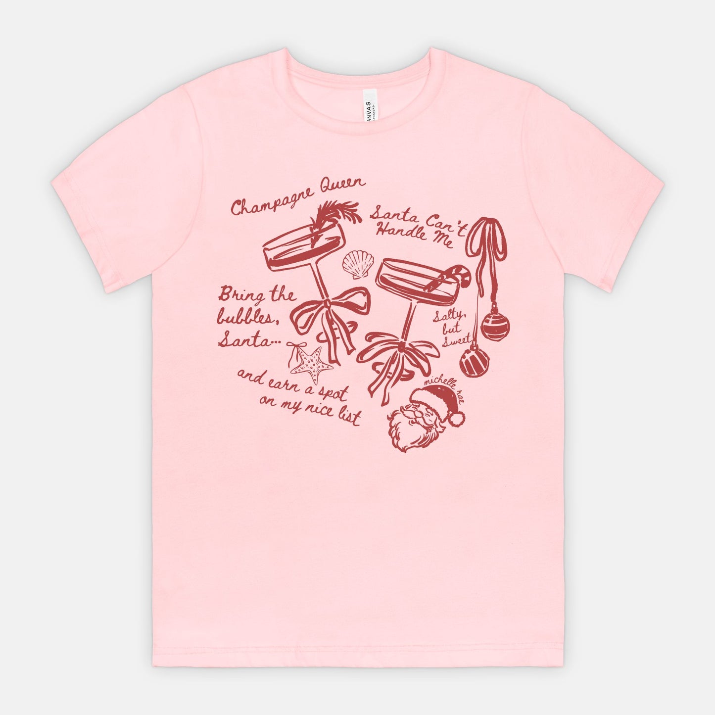 Champagne Queen Christmas Seashell Pink Tee – Coastal Santa Graphic Tee for Winter Comfort