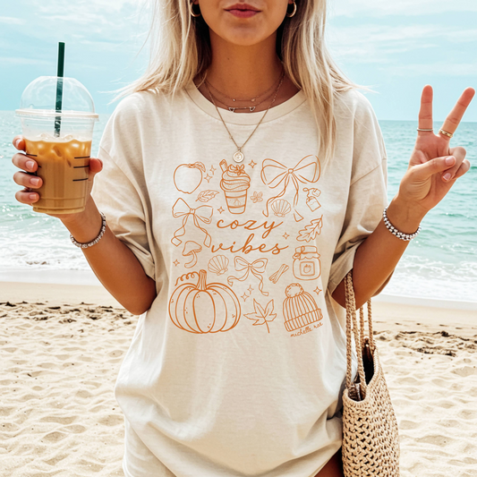 Cozy Vibes Seashell Ivory Tee – Coastal Fall Graphic Tee for Autumn Comfort